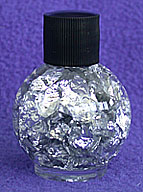 Silver Flakes In A Bottle