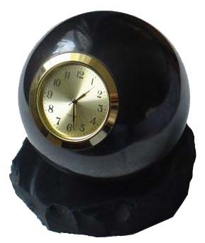 Shungite sphere with clock on the rack